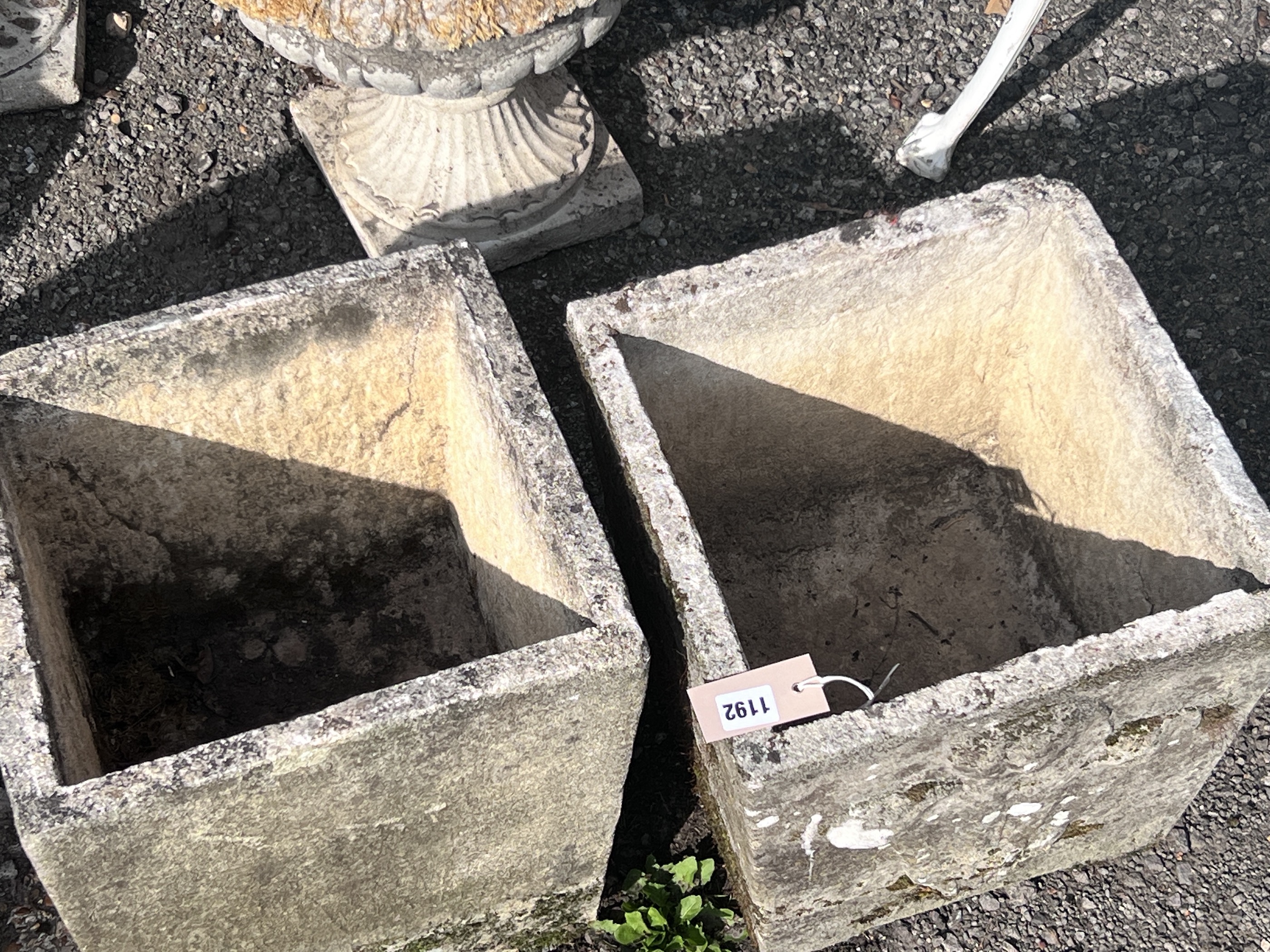Two composition square tapering planters, 'Prince of Wales feathers', width 34cm, height 37cm